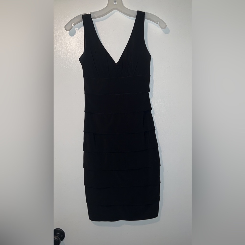 Pleated-tiered mini black dress.